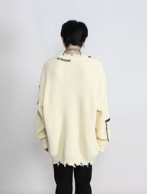 RIPPED KNITTED SWEATER